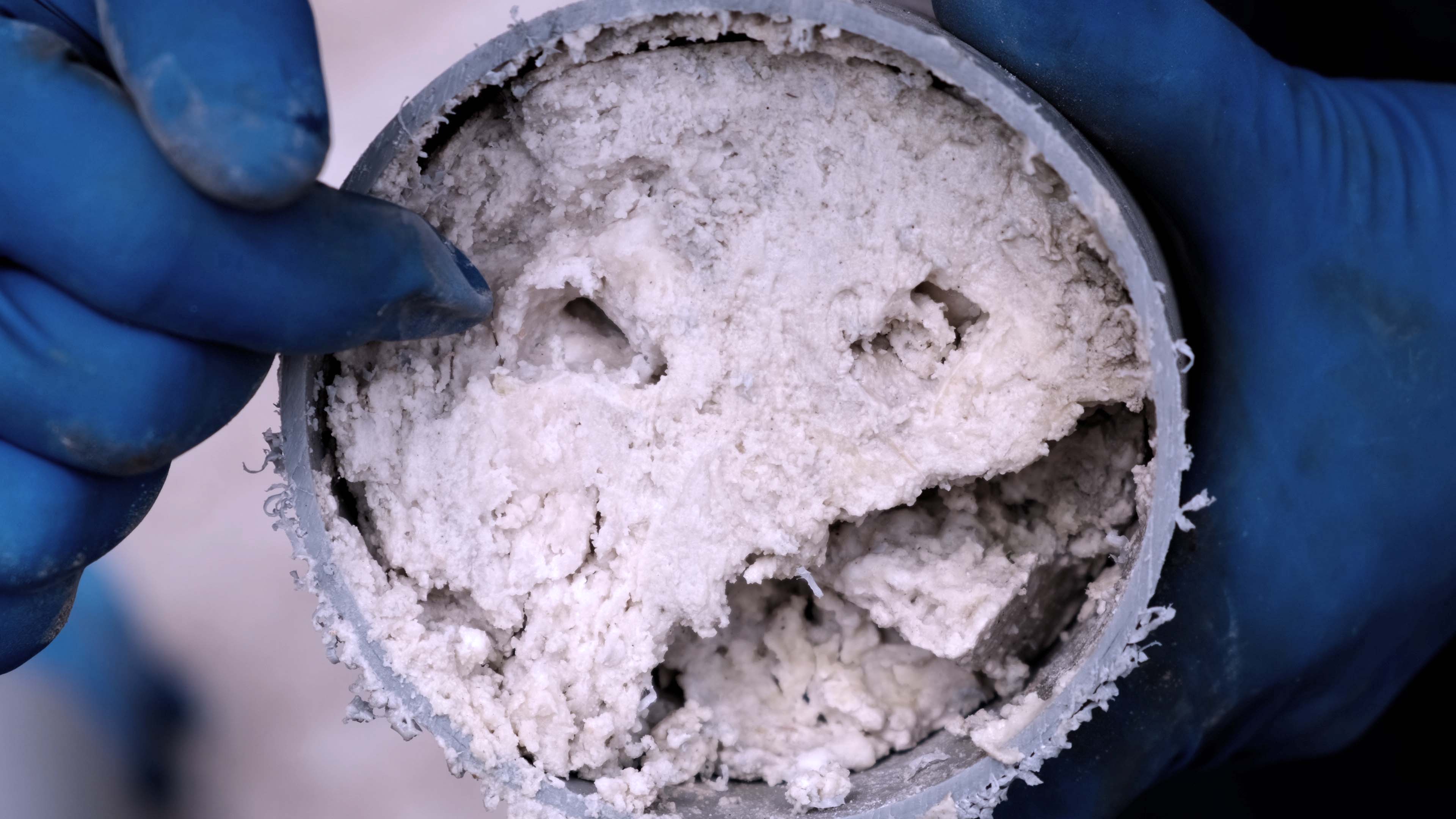 Grease deposits can completely block pipes.