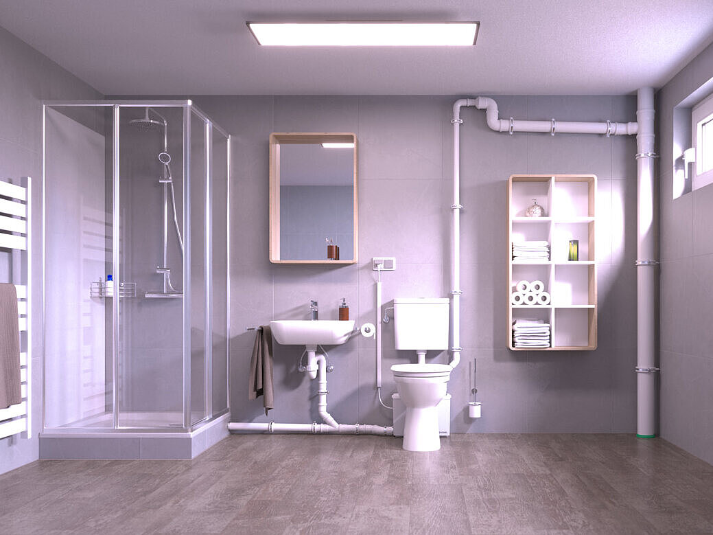 A basement room with a retrofitted toilet and a shower, which are drained via a small lifting station located behind the toilet.