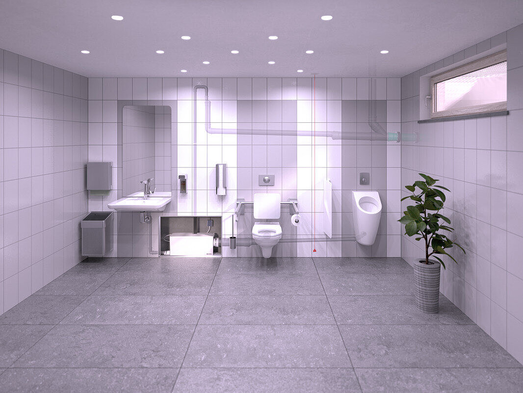 Installation diagram showing a restaurant toilet in the basement, where a washbasin, a urinal and a toilet are connected to the Minilift L WC Duo small lifting station, which is concealed within a pre-wall installation.