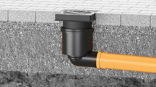 Built-in yard drain in a paved area