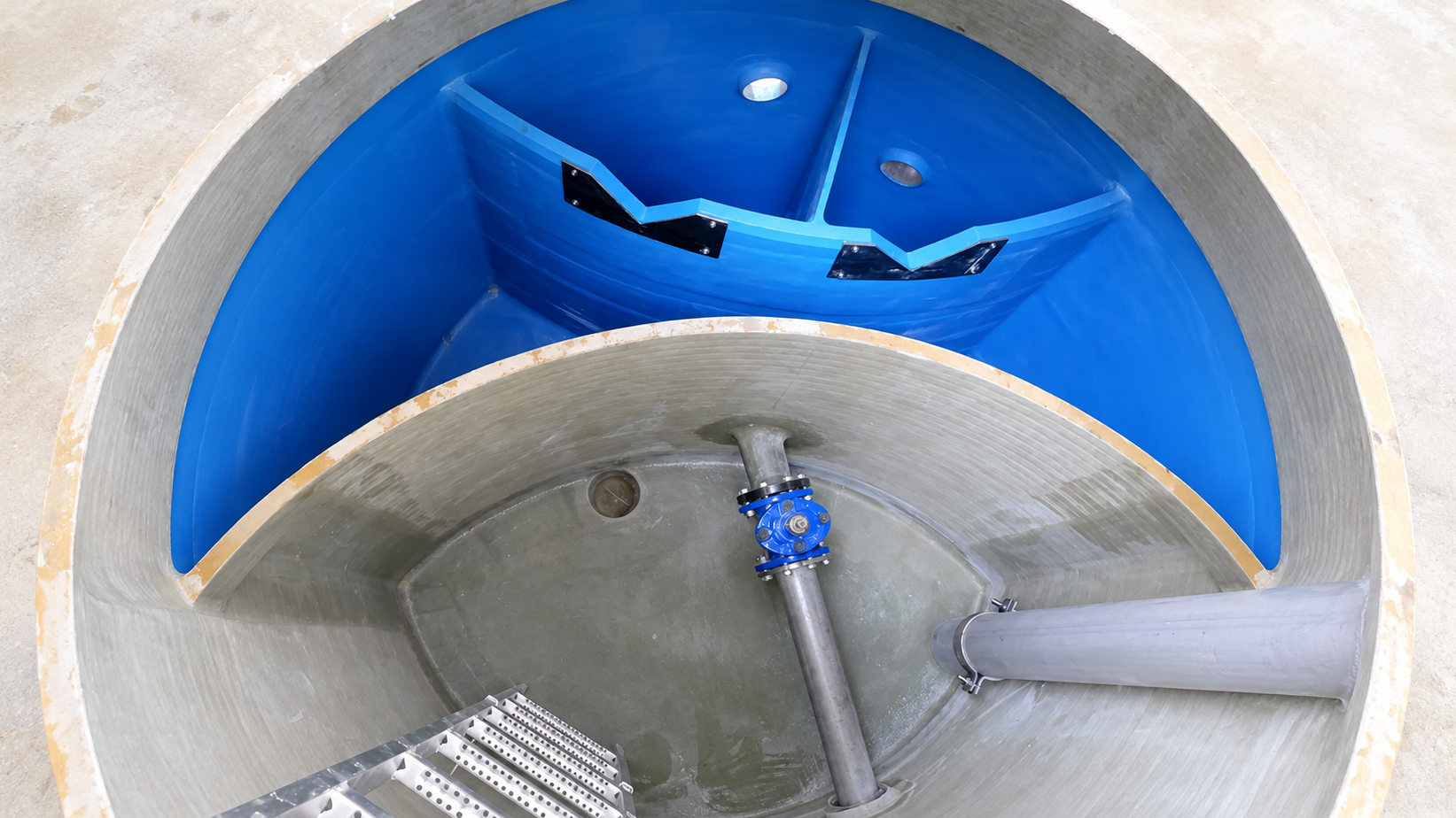 GRP chamber with a special geometry Bespoke GRP chamber with a special geometric layout and internal wall.